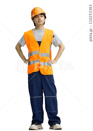 The guy is a builder, on a white background, full-length, hands on his belt 110253363