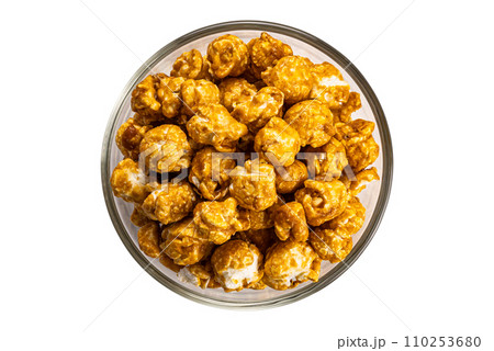 Top view caramel almonds in transparent glass bowl. Top view caramel almonds in transparent glass bowl. 110253680