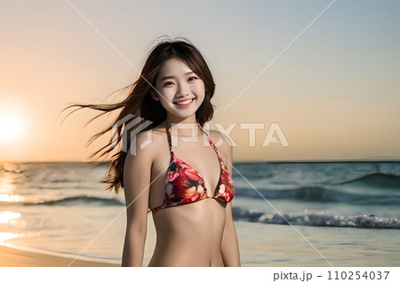 夕焼けをバックに健康的に微笑むビキニ姿の若い日本人女性 AI generated 110254037