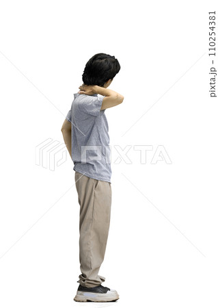 A guy in a gray T-shirt, on a white background, full-length A guy in a gray T-shirt, on a white background, full-length 110254381