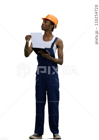 A male construction worker, on a white background, in full height, looking up 110254728