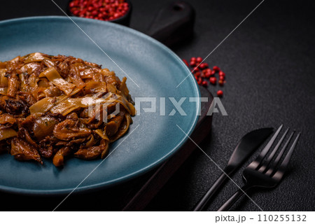 Delicious asian udon dish with vegetables, mushrooms, salt and spices 110255132