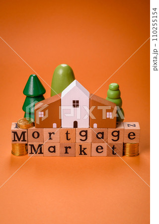 A small wooden house and keys as an idea for investing in your own home 110255154