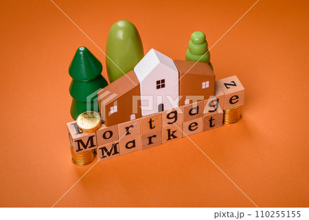 A small wooden house and keys as an idea for investing in your own home 110255155