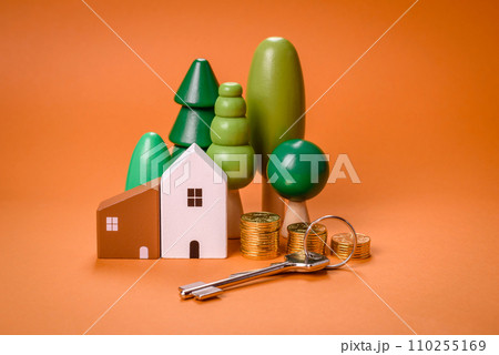 A small wooden house and keys as an idea for investing in your own home 110255169