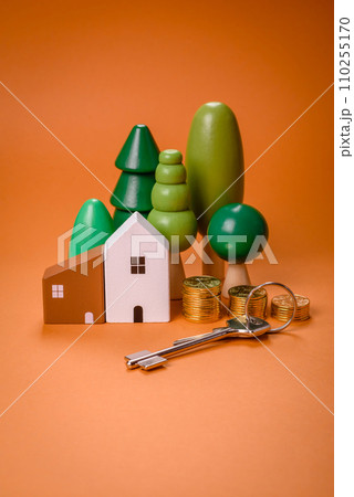 A small wooden house and keys as an idea for investing in your own home 110255170