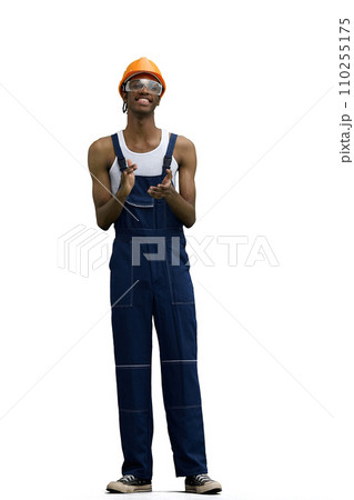 A male construction worker, on a white background, in full height, claps 110255175