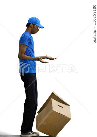 The male deliveryman, on a white background, in full height, dropped the box 110255180