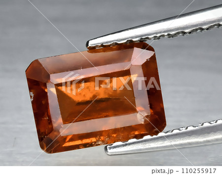 natural orange hessonite garnet gem on the background natural orange hessonite garnet gem on the background 110255917
