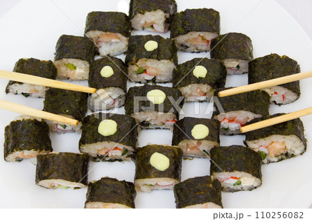 Japanese cuisine, rice sushi and fish - closeup Japanese cuisine, rice sushi and fish - closeup 110256082