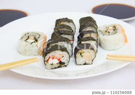 Japanese cuisine, rice sushi and fish - closeup Japanese cuisine, rice sushi and fish - closeup 110256089