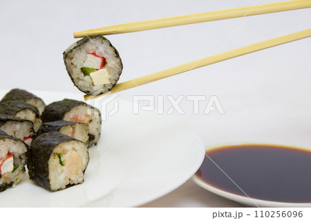 Japanese cuisine, rice sushi and fish - closeup Japanese cuisine, rice sushi and fish - closeup 110256096