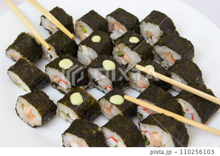 Japanese cuisine, rice sushi and fish - closeup 110256103