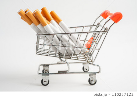 Cigarette on US dollar banknotes, cost, trading, marketing and production, No smoking, imort export concept. Cigarette on US dollar banknotes, cost, trading, marketing and production, No smoking, imort export concept. 110257123