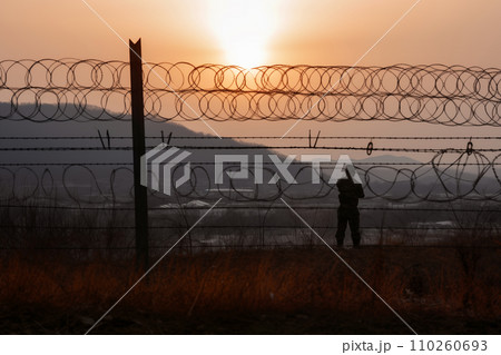 Border of South Kore and North Korea. Border with barbed wire on fence. 110260693