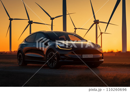 Electric Car in field with Wind turbines. EV electric car in Eolic park windpower. 110260696