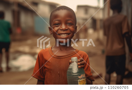 African boy with water bottle in hand. Black boy enjoying the water. African boy with water bottle in hand. Black boy enjoying the water. 110260705