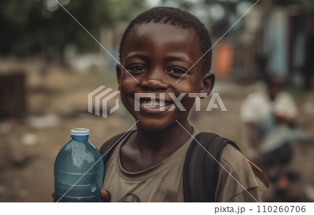 African boy with water bottle in hand. Black boy enjoying the water. 110260706