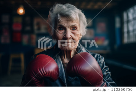 Grandmother boxer in boxing gloves on boxing ring.  110260750