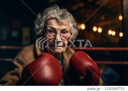 Grandmother boxer in boxing gloves on boxing ring.  110260752
