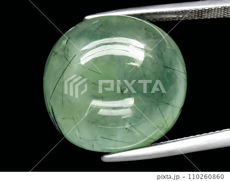 natural green prehnite gem on the background 110260860