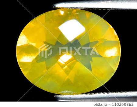 natural fire yellow opal gem on the background 110260862