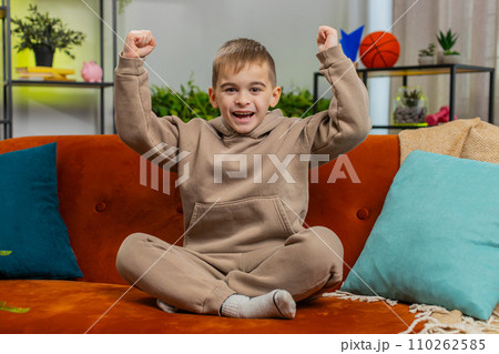 Excited child boy surprised, shocked by sudden victory, good win news, celebrating, wow reaction Excited child boy surprised, shocked by sudden victory, good win news, celebrating, wow reaction 110262585