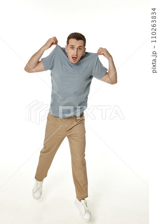 man holding himself by the shoulders isolated on white background 110263834