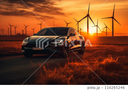 Electric Car in field with Wind turbines. EV electric car in Eolic park windpower. 110265246