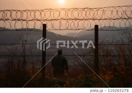 Border of South Kore and North Korea. Border with barbed wire on fence. Border of South Kore and North Korea. Border with barbed wire on fence. 110265278