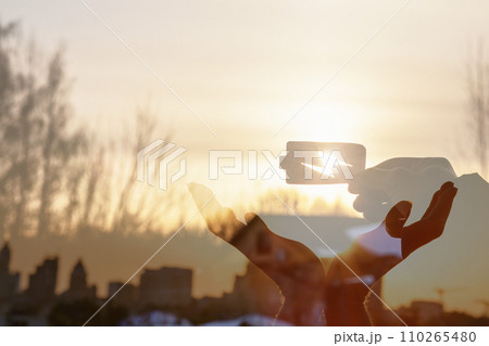 Hands sun sunset support protection. Hands sun sunset support protection. 110265480