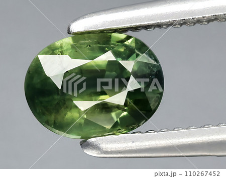 natural green blue sapphire gem on the background 110267452