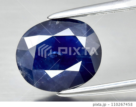 natural dark blue sapphire gem on the background 110267458