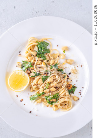 Lemon pasta with almonds 110268086