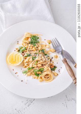 Lemon pasta with almonds 110268088