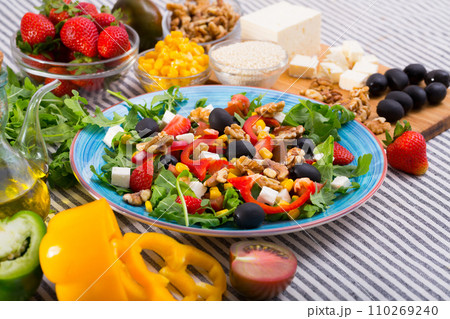 Ingredients and ready-made salad with rocket Ingredients and ready-made salad with rocket 110269240