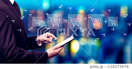 Online shopping theme with businessman using a tablet computer Online shopping theme with businessman using a tablet computer 110273478