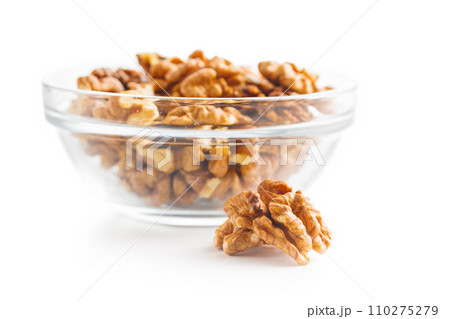 Peeled dried walnut kernels isolated on white background. Peeled dried walnut kernels isolated on white background. 110275279