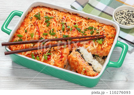 sushi bake with salmon, rice, seaweed, crab meat 110276093