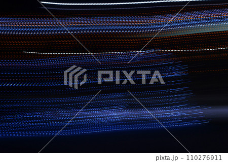 Random trajectories of light. Neon light lines in the dark. Digital chaos. Chaotic beams of light. Digital flow illustration. Futuristic de-focused background.  110276911