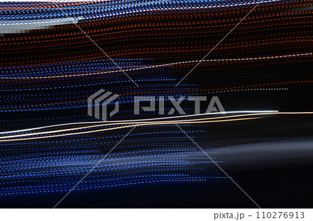Random trajectories of light. Neon light lines in the dark. Digital chaos. Chaotic beams of light. Digital flow illustration. Futuristic de-focused background.  110276913