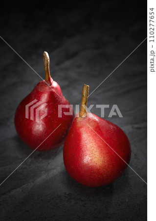 Red pear on wooden background Red pear on wooden background 110277654