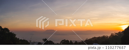travel and people activity concept with twilight sky before sunrise with mountain and fog on foreground 110277687
