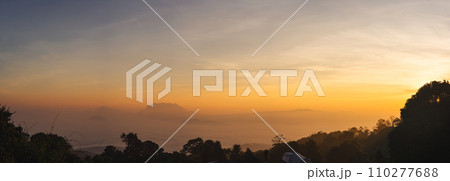 travel and people activity concept with panorama view twilight sky before sunrise with mountain and fog on foreground 110277688