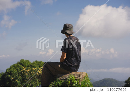 landscape and travel concept with solo freelancer man work and see cloud and sky with layer of mountain landscape and travel concept with solo freelancer man work and see cloud and sky with layer of mountain 110277693