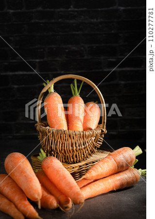 fresh carrots on black background fresh carrots on black background 110277781