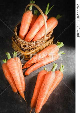 fresh carrots on black background 110277792