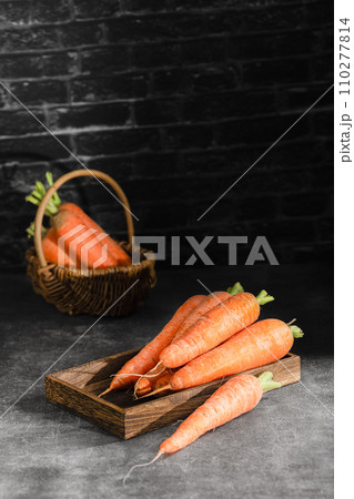 fresh carrots on black background 110277814