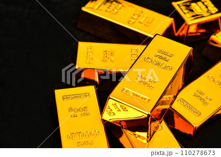 Close up photo a gold bar on black background Close up photo a gold bar on black background 110278673