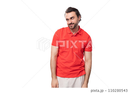 young brutal caucasian brunette man with a beard dressed in red clothes on a studio background with young brutal caucasian brunette man with a beard dressed in red clothes on a studio background with 110280543
